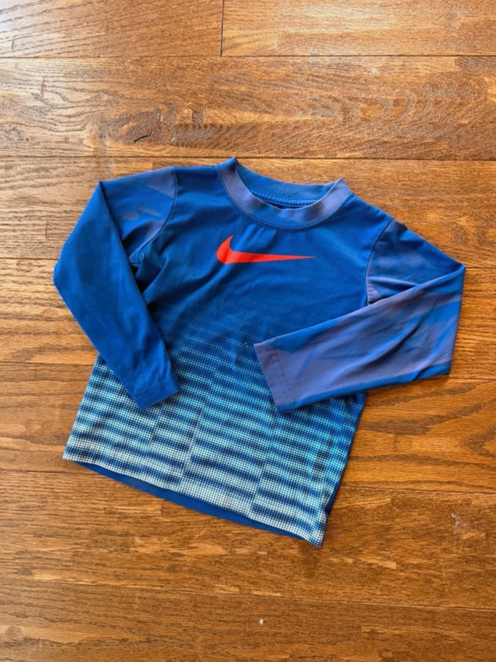 Nike Blue Long-Sleeve Athletic Top with Red Swoosh